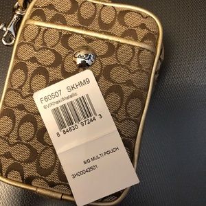 Coach Accessories - Coach cell phone case or change purse with strap Coach Accessories - Coach cell phone case or change purse with strap